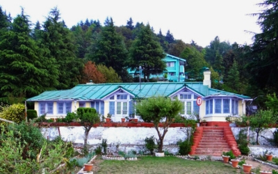 The colonial-era Mukteshwar Inspection Bungalow surrounded by green trees